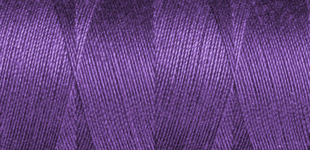 Purple, violet sewing thread texture close upの写真素材