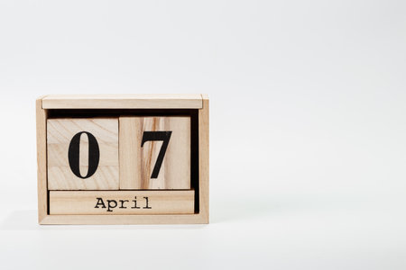 Wooden calendar April 07 on a white background close upの写真素材