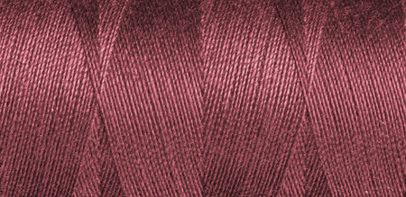 Red sewing thread texture close upの写真素材