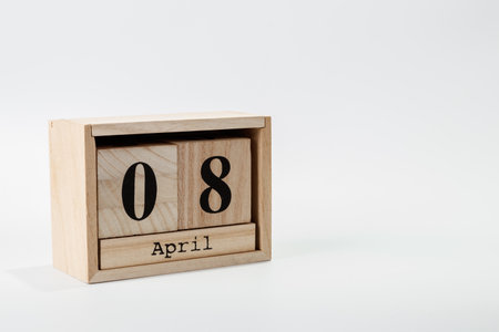 Wooden calendar April 08 on a white background close upの写真素材