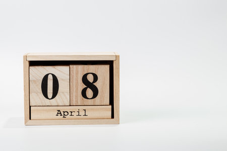 Wooden calendar April 08 on a white background close upの写真素材