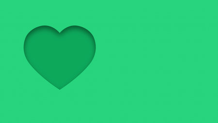 Green textured canvas background with heart shape cutout close upの写真素材