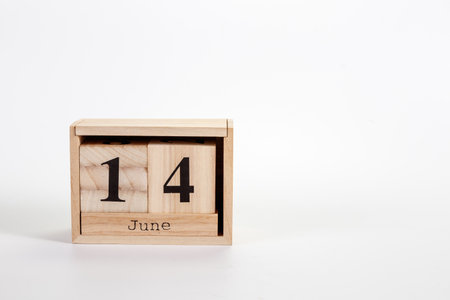 Wooden calendar June 14 on a white background close upの写真素材