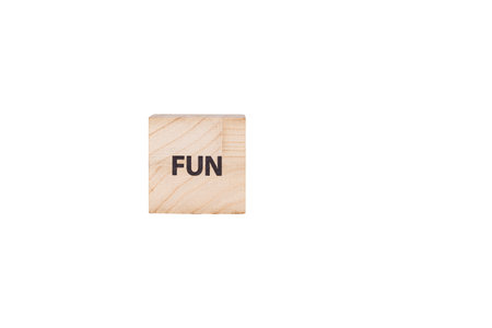 wooden cubes with the inscription Fun on a white isolated background close-upの写真素材