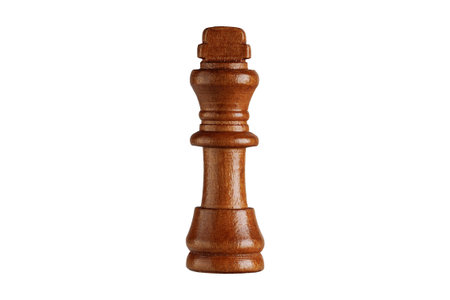 Closeup of a wooden black king chess piece on white backdrop. Ideal for strategy games and intellectual concepts.の写真素材