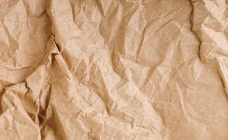 Brown texture kraft paper, recycled cardstock. Old crumpled recycled paper close-up of old crumpled recycled paperの写真素材
