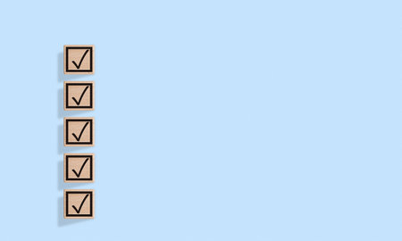 Wooden blocks with checkmarks on a background are ideal for task management. Their bold design adds a vibrant touch to productivity visuals.の写真素材