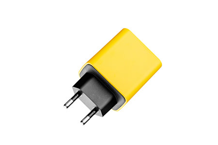 adapter for charger with USB and Type C connector, yellow, on isolated or white background close-upの写真素材