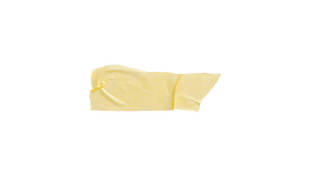Yellow painter's tape isolated on white background, macro. Torn, crumpled, twisted strips of yellow painter's tape on white background, close-up.の写真素材