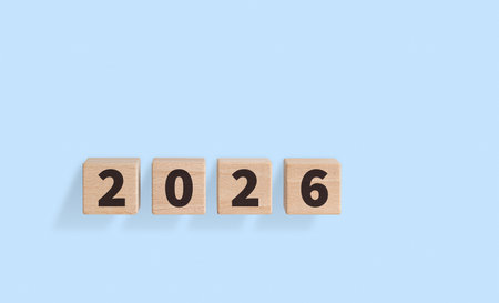 Wooden blocks with 2026 text on a blue background are great for planning. Their rustic...