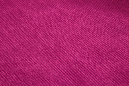Textured corduroy furniture fabric in pink colors close-upの写真素材