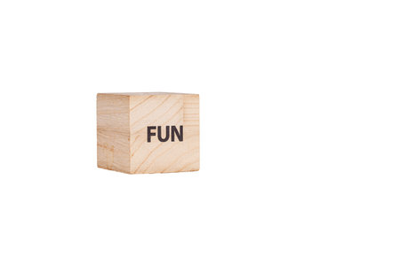 wooden cubes with the inscription Fun on a white isolated background close-upの写真素材