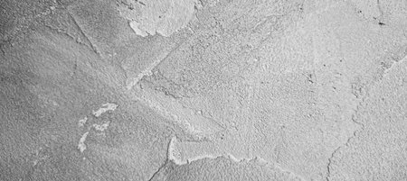 Rough cement wall texture with detailed gray patterns. Ideal for architectural designs, urban concepts, and creative backgrounds.の写真素材