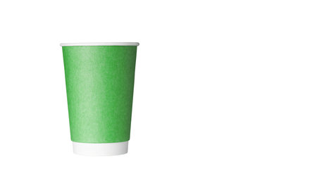 cardboard glass of green color, for coffee or tea on an isolated white background close upの写真素材