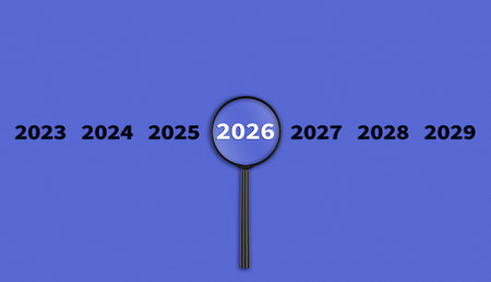 Lens, magnifying glass focusing on the year 2026 on a Purple background. Financial or stock market strategies and past and future events. Close-upの写真素材