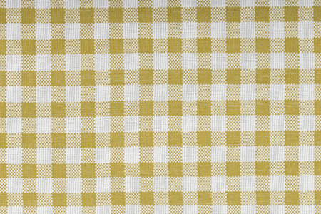Yellow and white checkered, pattern, design, cotton fabric for sewing, texture background close-upの写真素材
