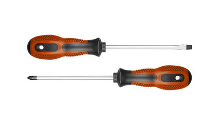 Two screwdrivers, flat and Phillips, are designed for construction work. Their durable handles ensure efficiency in tough environments Brown color on isolated white background close-upの写真素材