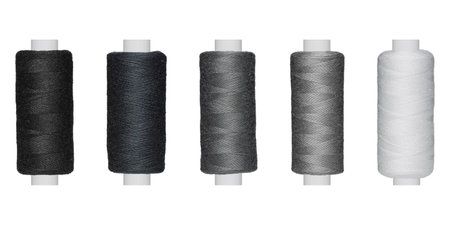 A colorful thread mesh in black, gray and white shines on a white background. Ideal for crafting, sewing, or design projects.の写真素材