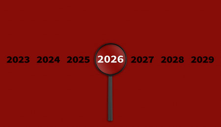 Lens, magnifying glass focusing on the year 2026 on a red background. Financial or stock market strategies and past and future events. Close-upの写真素材