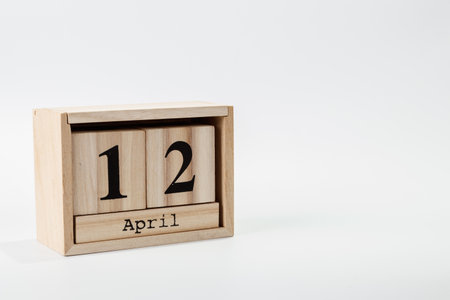 Wooden calendar April 12 on a white background close upの写真素材