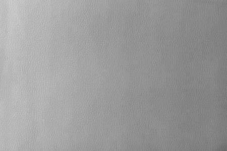 Texture of genuine leather, artificial leatherette gray background close-upの写真素材