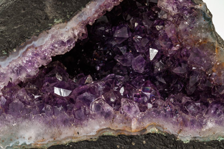 Amethyst Crystal Druse macro mineral on white background close up