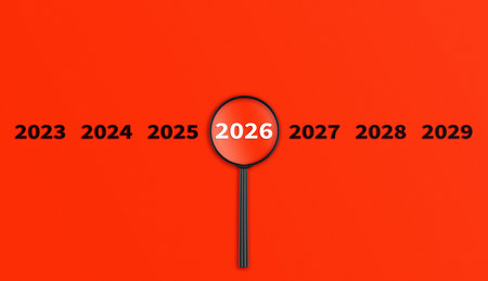 Lens, magnifying glass focusing on the year 2026 on a red background. Financial or stock market...