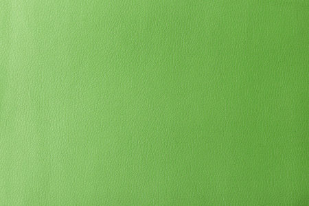 Texture of genuine leather, artificial leatherette green background close-upの写真素材