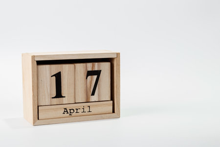 Wooden calendar April 17 on a white background close upの写真素材