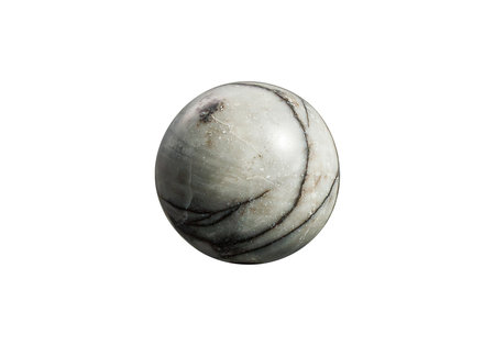 A polished sphere on a white isolated background, featuring striking black and white patterns with a glossy finish. Ideal for decor, meditation, or mineral collections.の写真素材