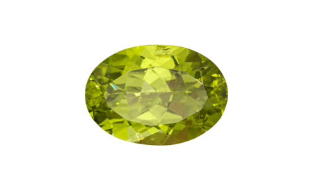 A lustrous peridot gemstone with an oval cut, featuring a vibrant green hue and sparkling facets....