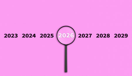 Lens, magnifying glass focusing on the year 2026 on a Pink background. Financial or stock market...