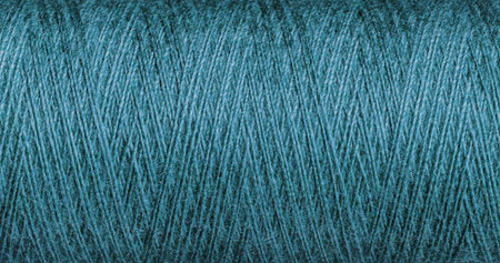 A Blue thread texture with weave enhances creative craft projects. Its detailed structure inspires...