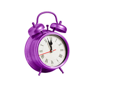 retro clock, pointer clock, pink color alarm clock on isolated white background close up