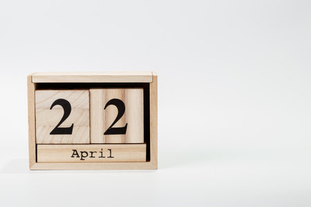 Wooden calendar April 22 on a white background close upの写真素材