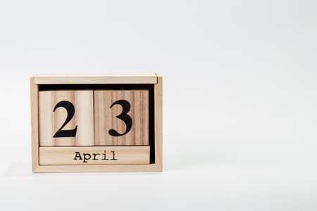 Wooden calendar April 23 on a white background close upの写真素材