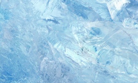 crystal displays frozen textures with cool blue hues. The icy surface reveals natural crack patterns...