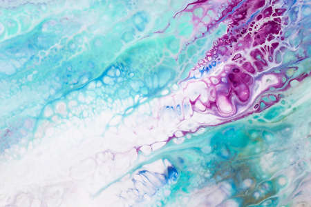 Abstract picture of the sea water with foam and bubbles. Multicolored fluid art. Acrylic pour of blue, turquoise and pink paints.の写真素材