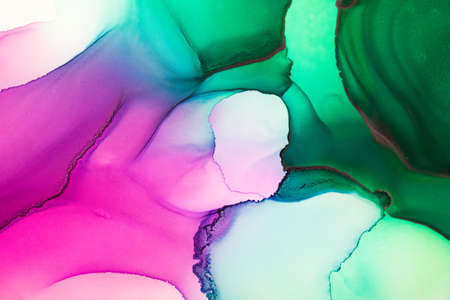 Abstract fluid art painting background in alcohol ink technique, mixture of magenta, purple and green paints. Transparent overlayers of ink create veins and gradients.の写真素材