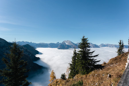 Panoramic view of the foggy valley of the Austrian Alpsの写真素材