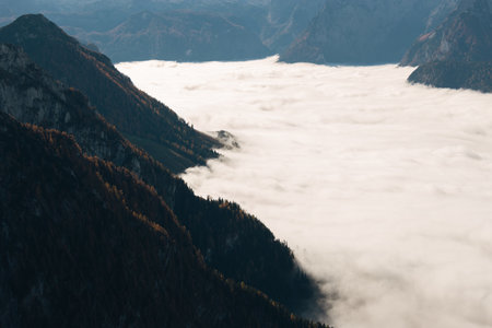 Aerial view of clouds in the mountains. View from above.の写真素材