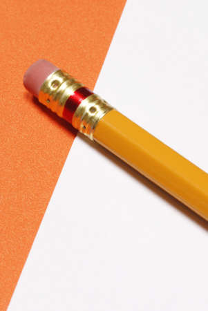 pencil with eraser on white and orange backgroundの写真素材