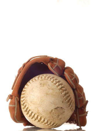 weathered baseball and baseball glove isolated on white backgroundの写真素材