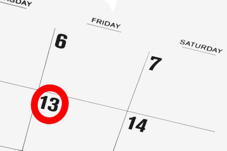 calendar with  friday the thirteenth circled in redの写真素材