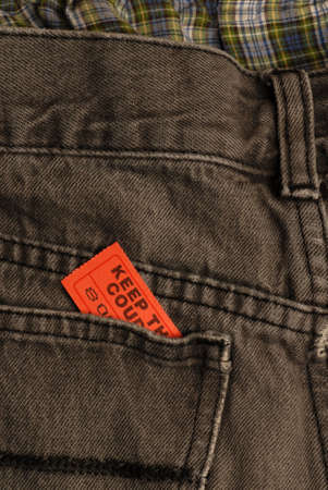 ticket in back pocket of pair of pants or jeansの写真素材