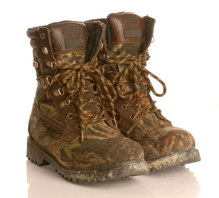 camouflage hunting boots isolated on white backgroundの写真素材