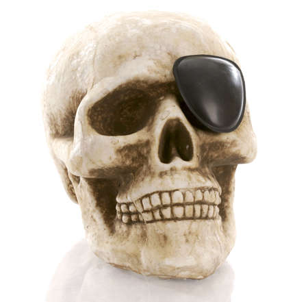  human skull with eye patch on white backgroundの写真素材