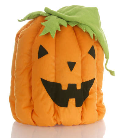 stuffed pumpkin or jack-o-lantern with reflection on white backgroundの写真素材