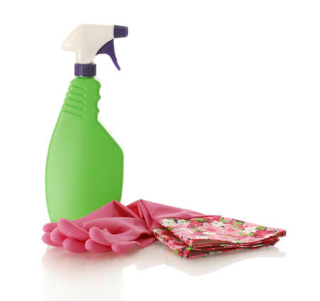 rubber gloves laying beside blank spray cleaning bottleの写真素材