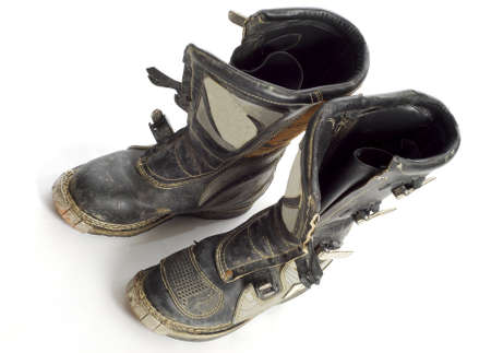 motocross bike boots with reflection on white backgroundの写真素材